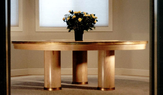 A huge round birdseye veneer table, with gold leaf and Lazy Susan